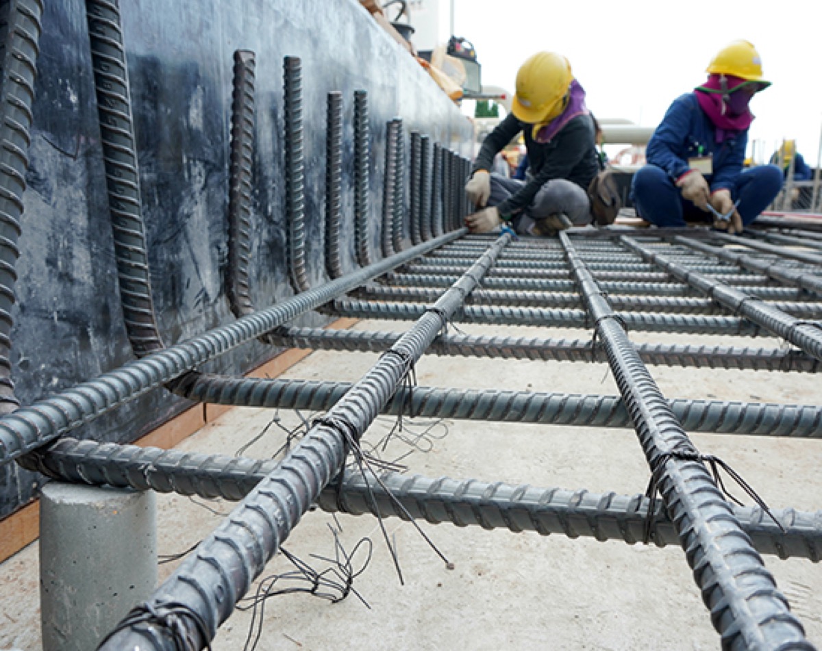 TREMO team securing rebar at a construction site in San Diego, emphasizing safety and quality focus